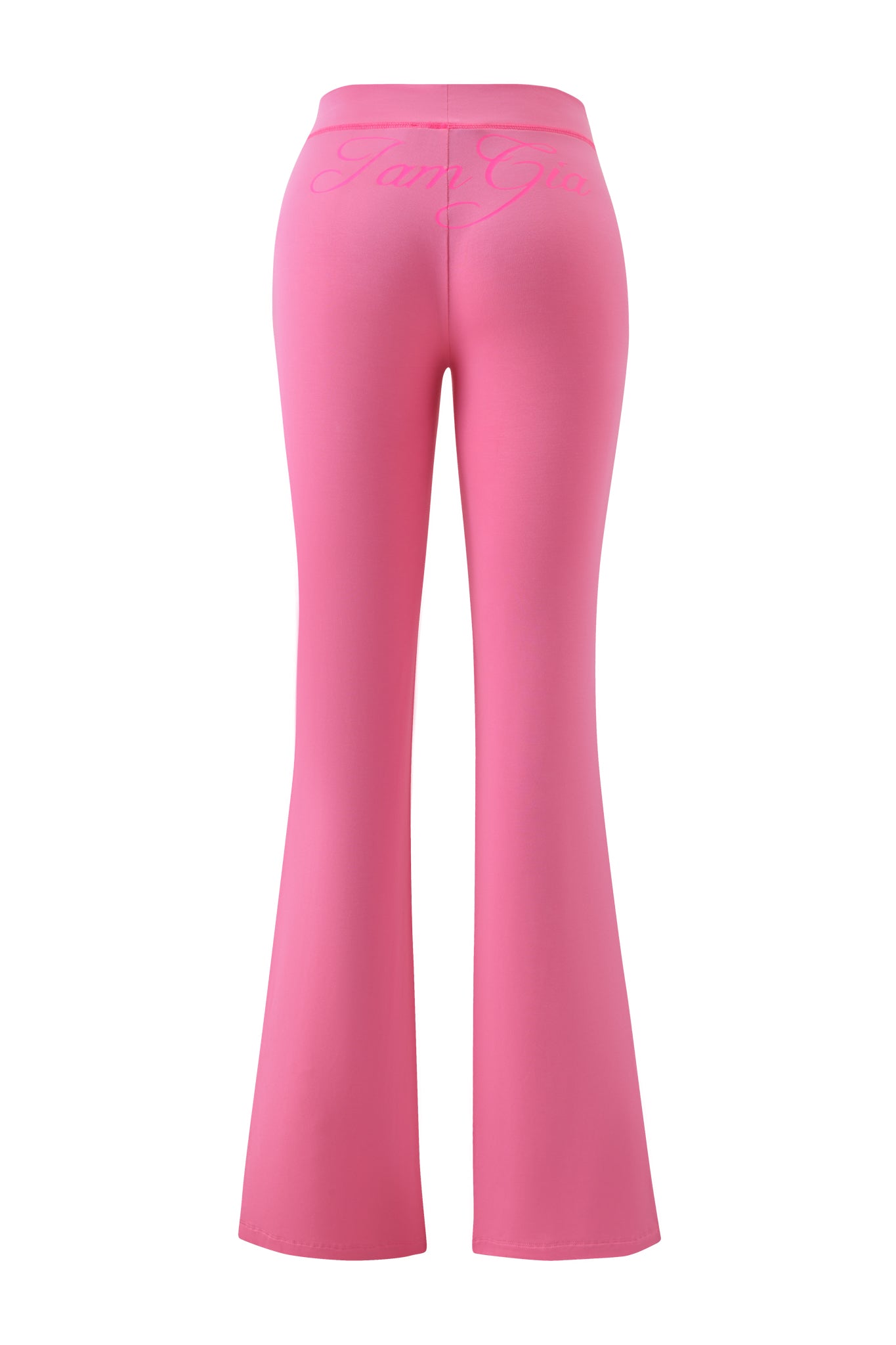 Back view of BLARE TRACKPANT - NEON PINK by I.AM.GIA, high-waisted with a flared fit and the I.AM.GIA logo in cursive across the waistband.