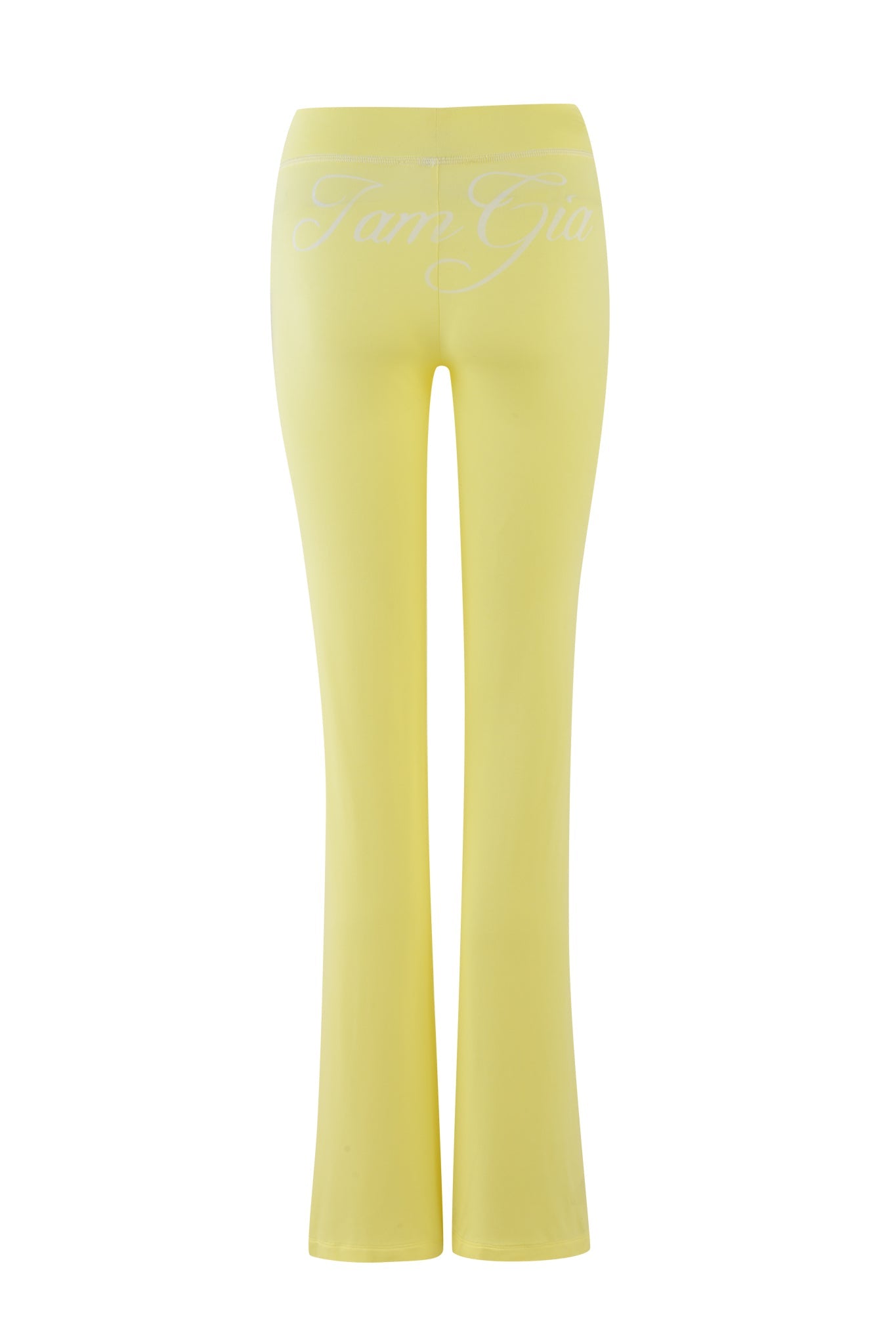 Pale yellow BLARE TRACKPANT from I.AM.GIA has a high waist and is adorned with the brand's logo in white cursive on the back, displayed in rear view against a white background.