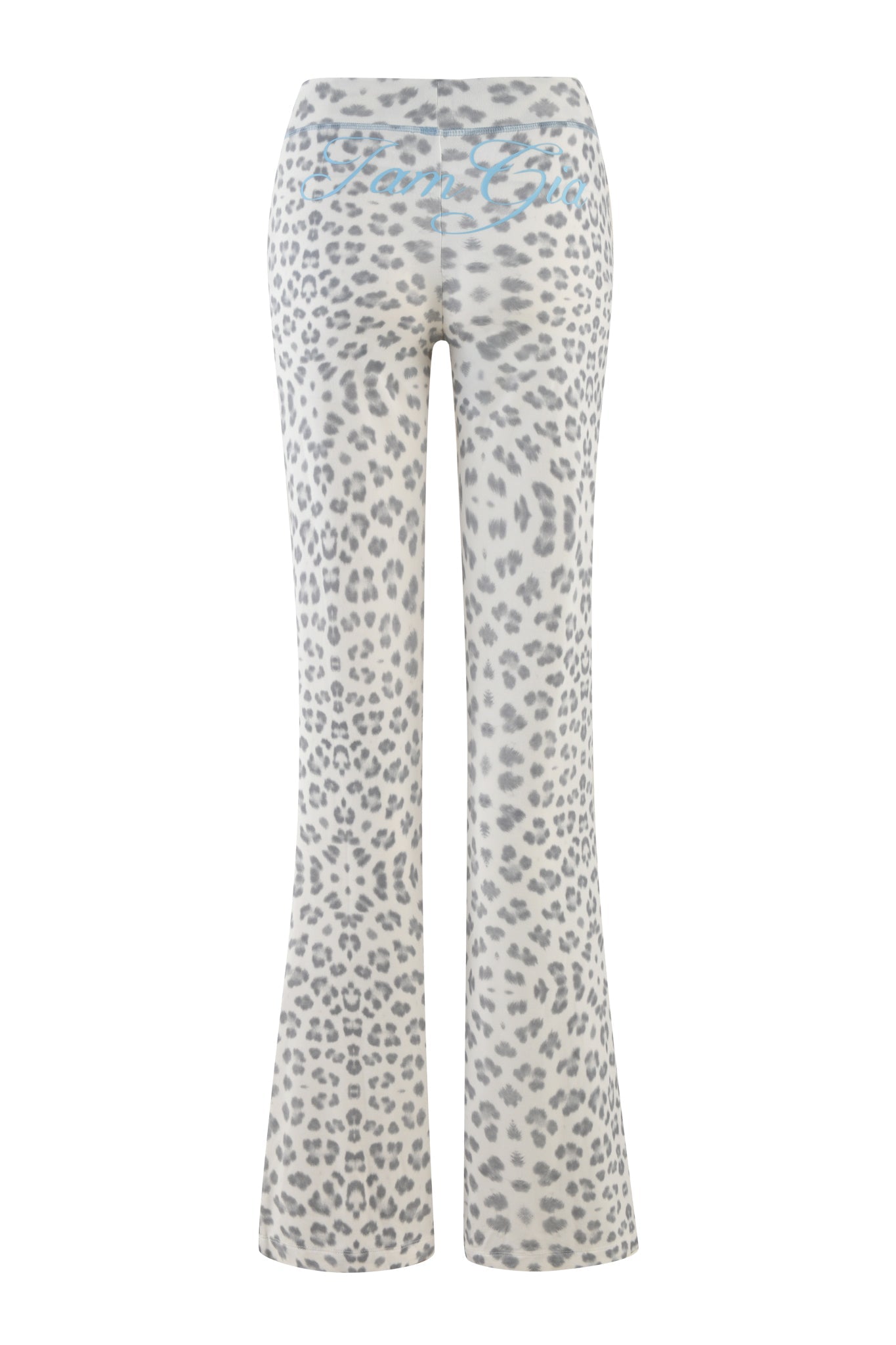 The I.AM.GIA BLARE TRACKPANT - SNOW LEOPARD : WINTER WILD CARD showcases a grey snow leopard print with a high waist and an eye-catching blue design on the waistband, all set against a white background.