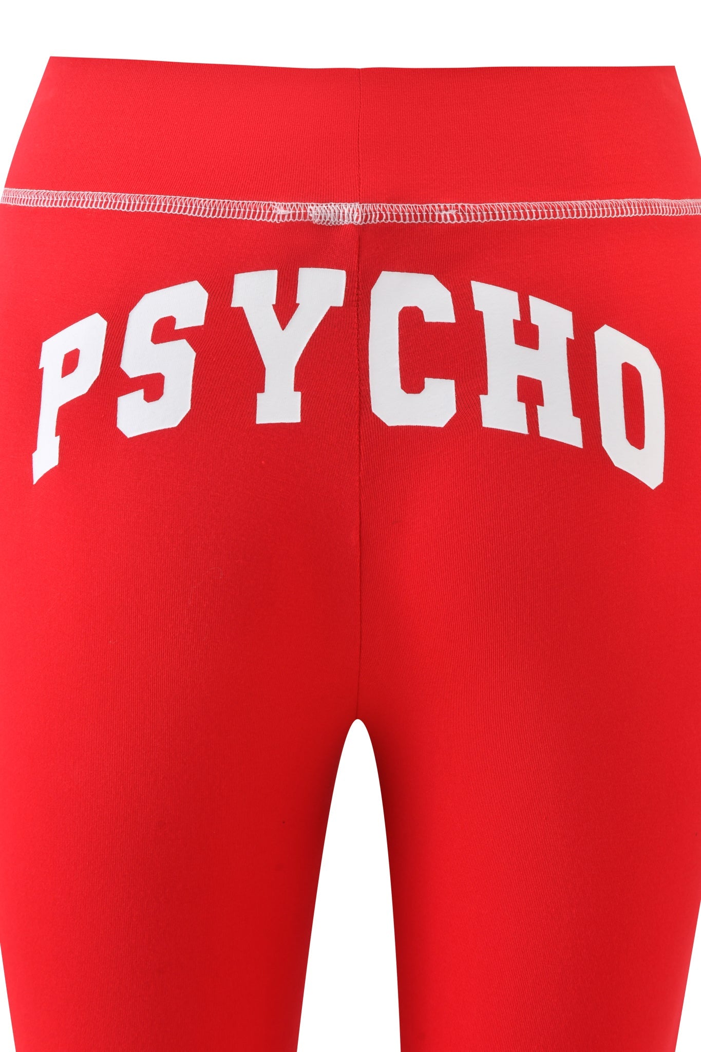 The BLARE TRACKPANT - RED : PSYCHO : SALSA by I.AM.GIA features low-rise styling and bold white "PSYCHO" lettering across the back waistband.
