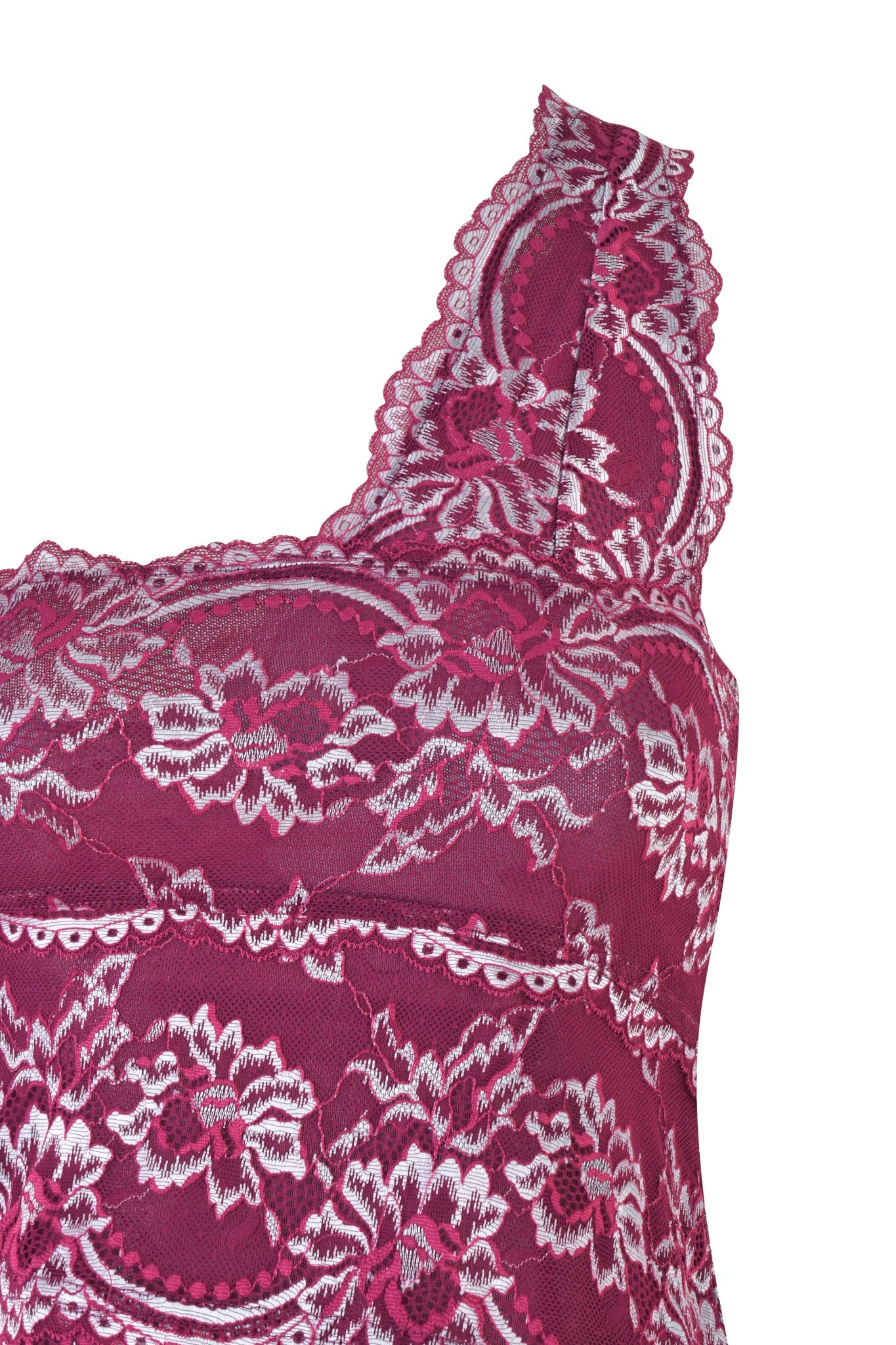 Close-up of the PHOENIX TOP - PURPLE : PLUM by I.AM.GIA, highlighting intricate scalloped lace detailing and floral patterns on a bodycon silhouette. The top features a scooped neckline with delicate scalloped edges, enhancing its elegant allure.