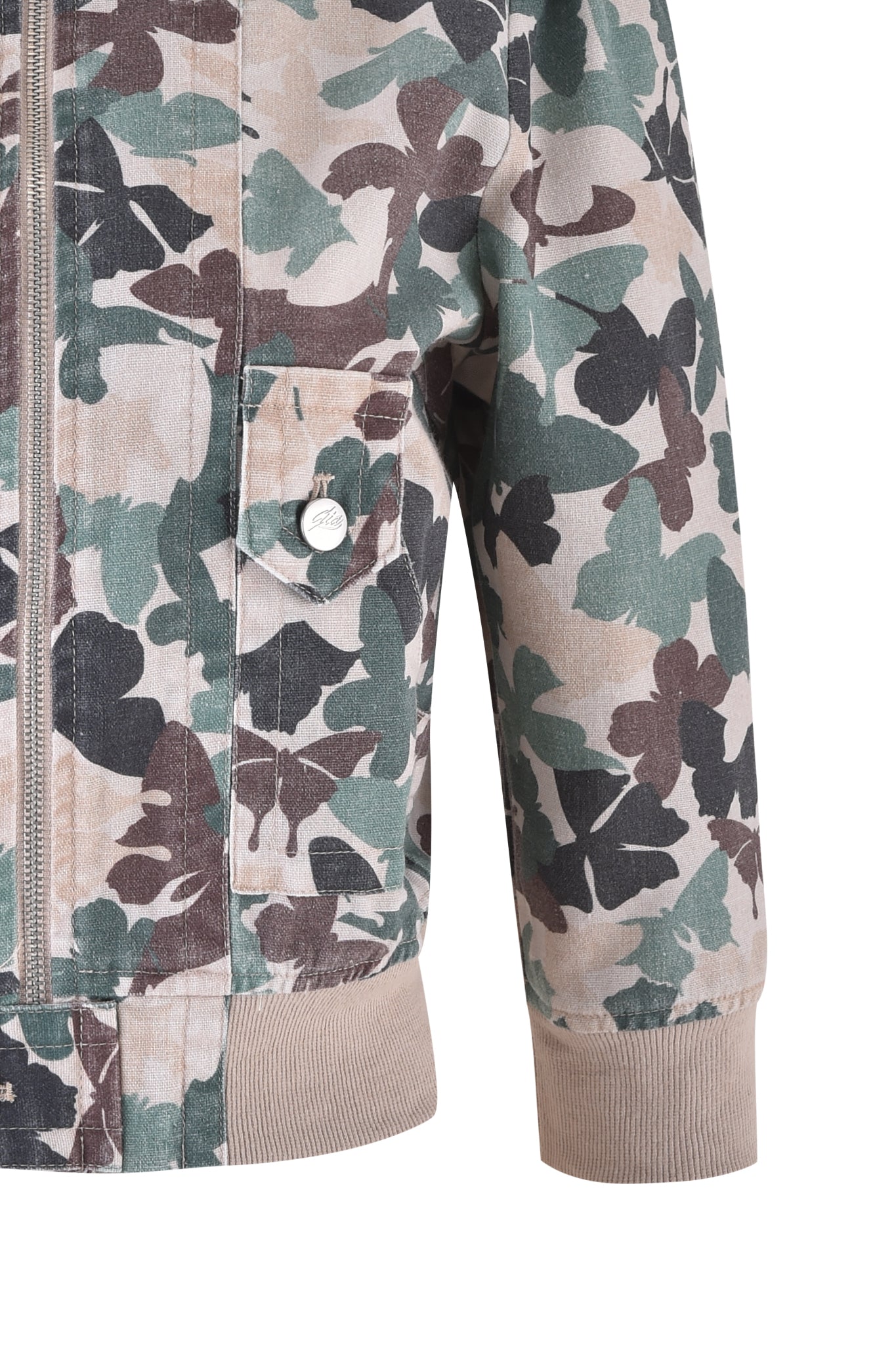 Close-up of the I.AM.GIA EFFIE JACKET in Flutter Camo, featuring a butterfly camo print in beige, green, and brown hues. This exclusive cropped cargo jacket includes a front zipper, logo-buttoned pocket, and ribbed cuffs and hem.