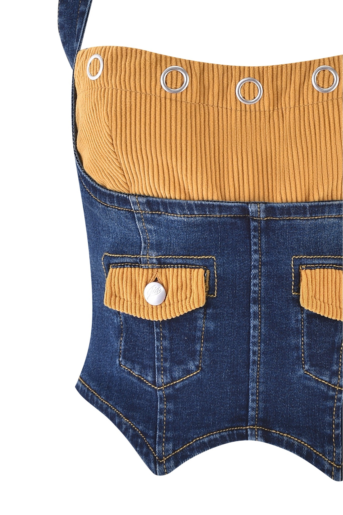 The TOMMIE CORSET - DARK WASH by I.AM.GIA is a denim corset-style top with adjustable straps, mustard corduroy bust and pocket flaps, plus silver grommets and button accents.