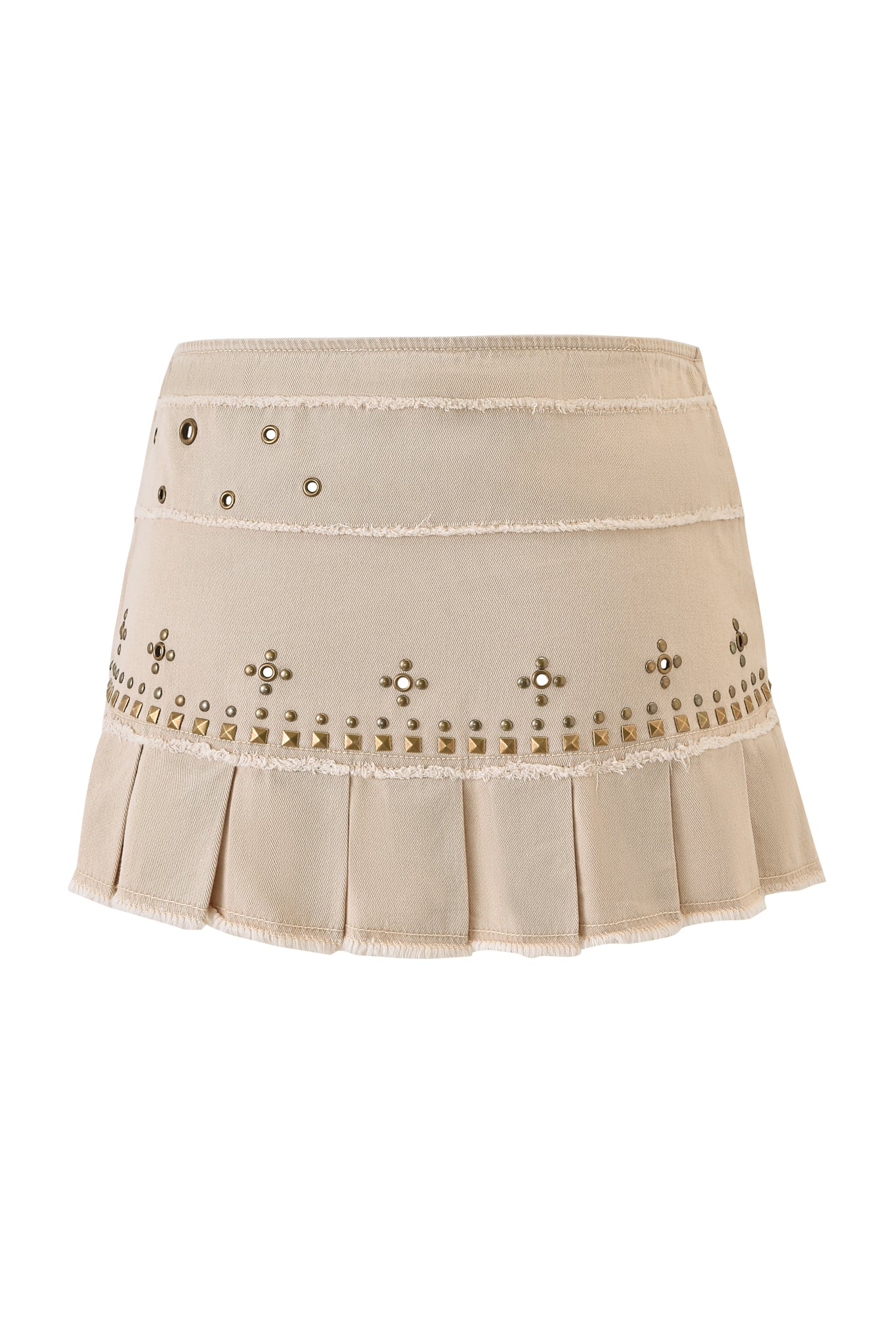The MASON MINI SKIRT - TAN by I.AM.GIA features a low-rise waist, horizontal seams, metallic studs, decorative grommets, pleated hem, frayed edges, and an embellished design near the bottom. Displayed on a plain white background.