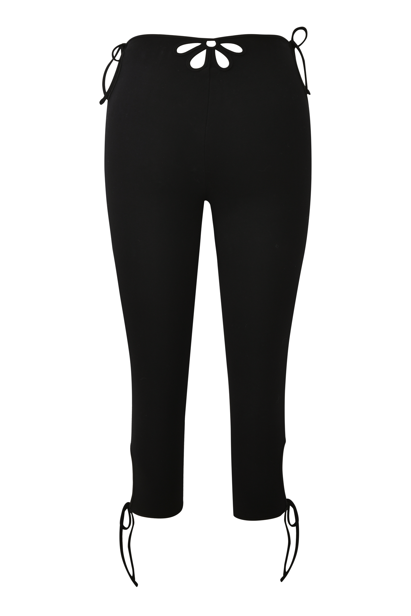 The YUNA CAPRI - BLACK by I.AM.GIA are black high-waisted, body-con leggings with floral cut-outs and silver ring accents at the waist, hips, and ankles, displayed on a plain white background.