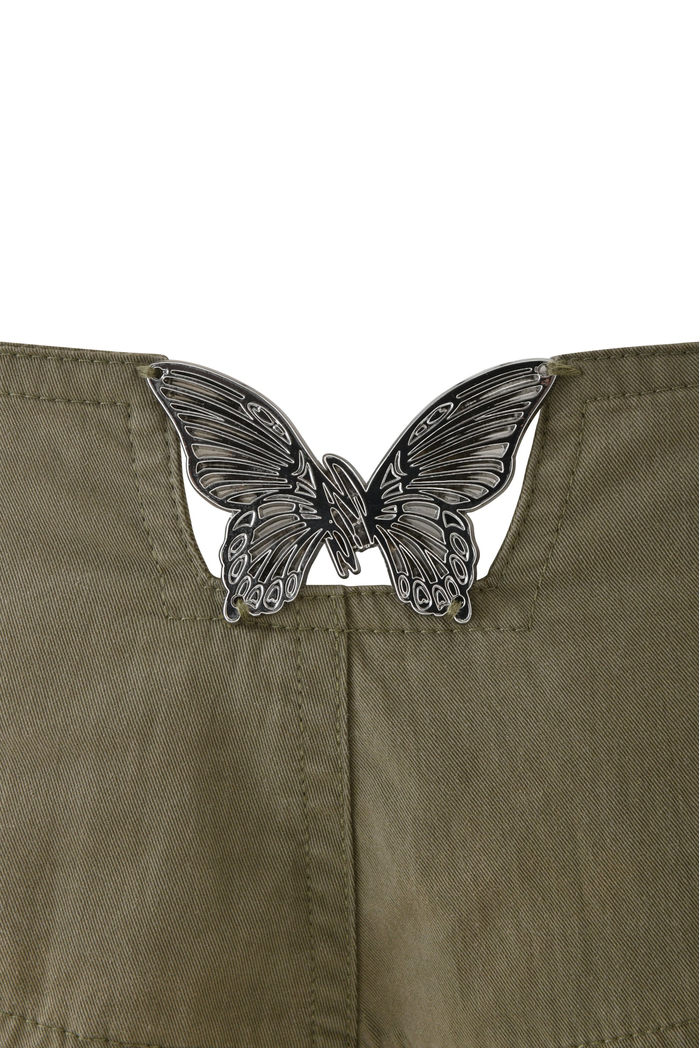 A close-up of I.AM.GIA's SEQUOIA PANT in Army Green, featuring cotton cargo fabric and a metal butterfly accessory attached at the top near a V-shaped cut.