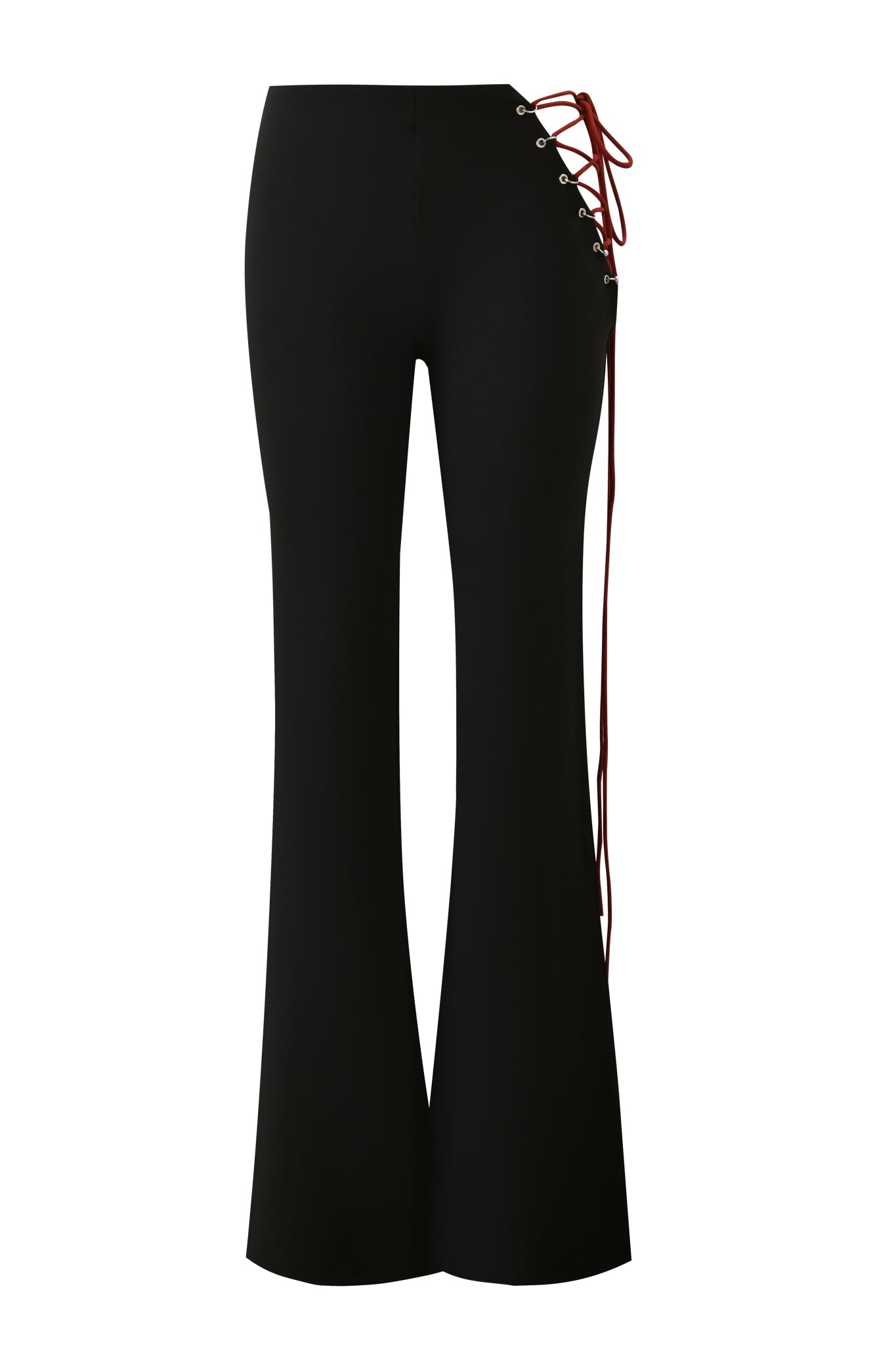 The ONYX PANT - BLACK by I.AM.GIA is a high-waisted black pant featuring metal eyelets, red lace-up detail with long hanging laces along one side, and a bold cutout at the hip for an edgy look.