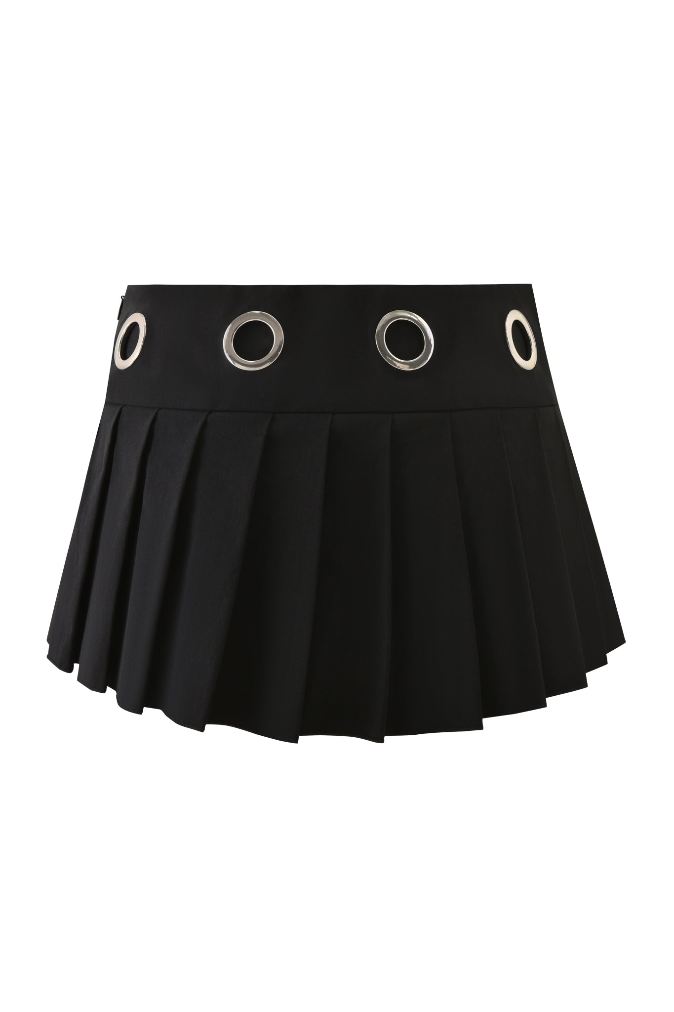 The JAYMES SKORT - BLACK by I.AM.GIA is a black pleated mini skort with a low-rise waist and large silver grommets on the waistband, shown against a white background.