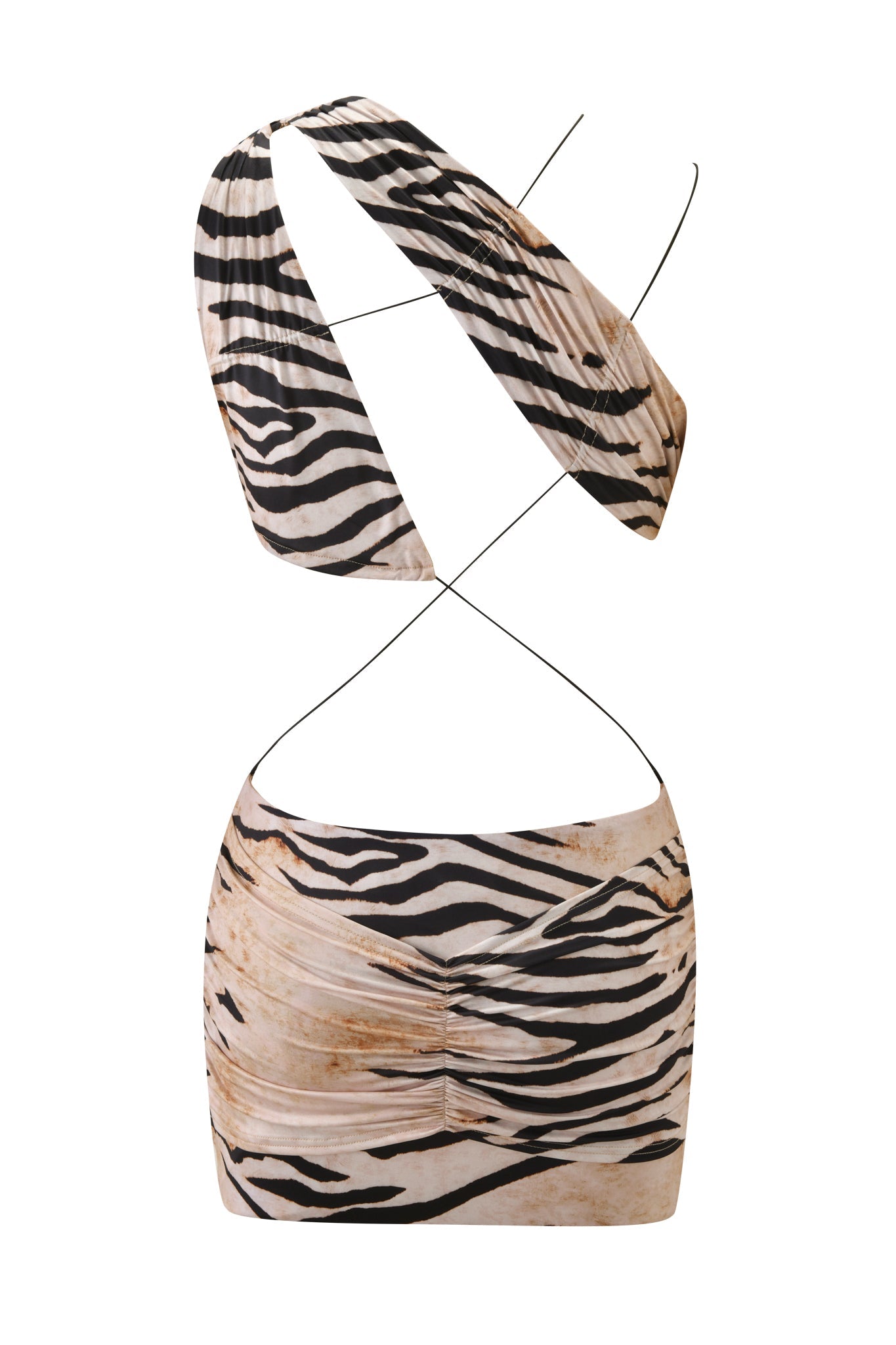 The I.AM.GIA SASKIA MINI DRESS - WILD SIDE is a bold two-piece set with a beige and black zebra print, featuring a one-shoulder crop top with thin crossing straps and a high-waisted ruched mini skirt.