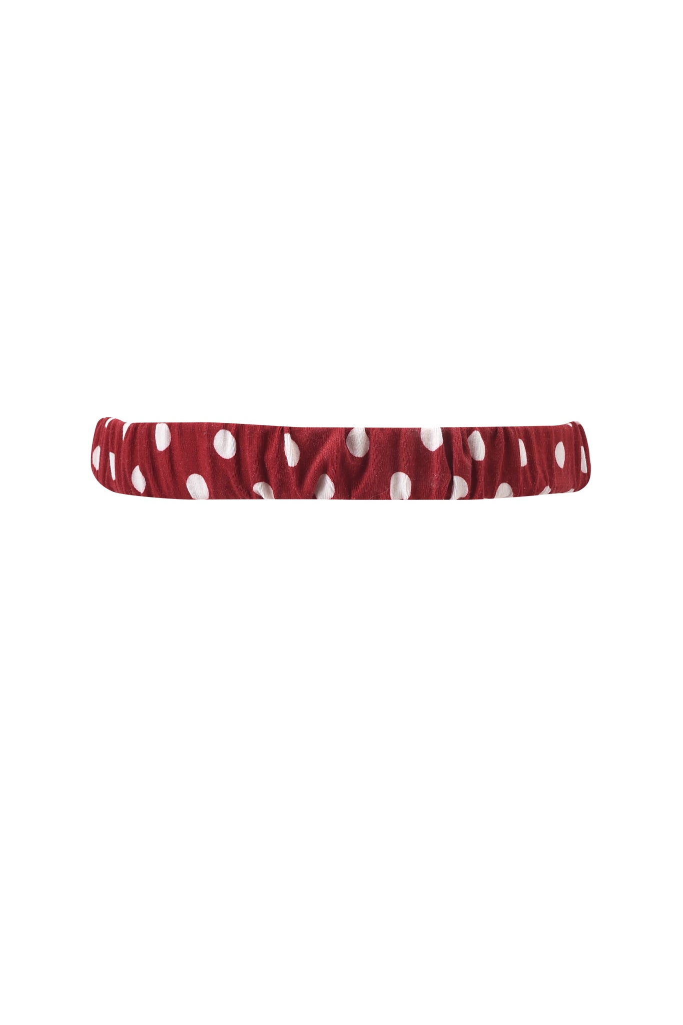 The MELANIE SLEEPWEAR - RED POLKA DOT by I.AM.GIA is a red fabric headband with playful polka dots and an elasticized design, shown on a plain white background.