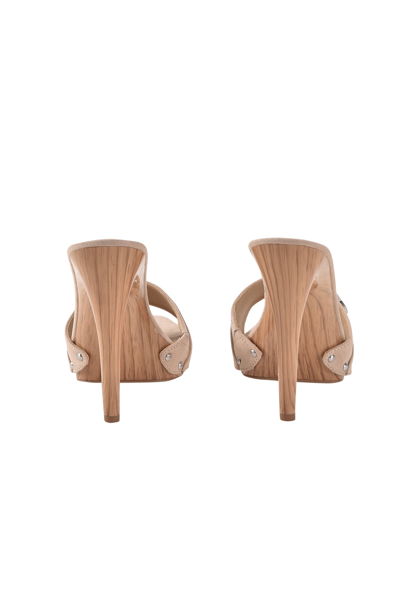 The NICKY HEEL - TAN SUEDE by I.AM.GIA is a pair of slip-on mules with light wood-finished narrow stiletto heels, metallic rivet accents on the sides, and a tan suede design, shown from the back on a plain white background.