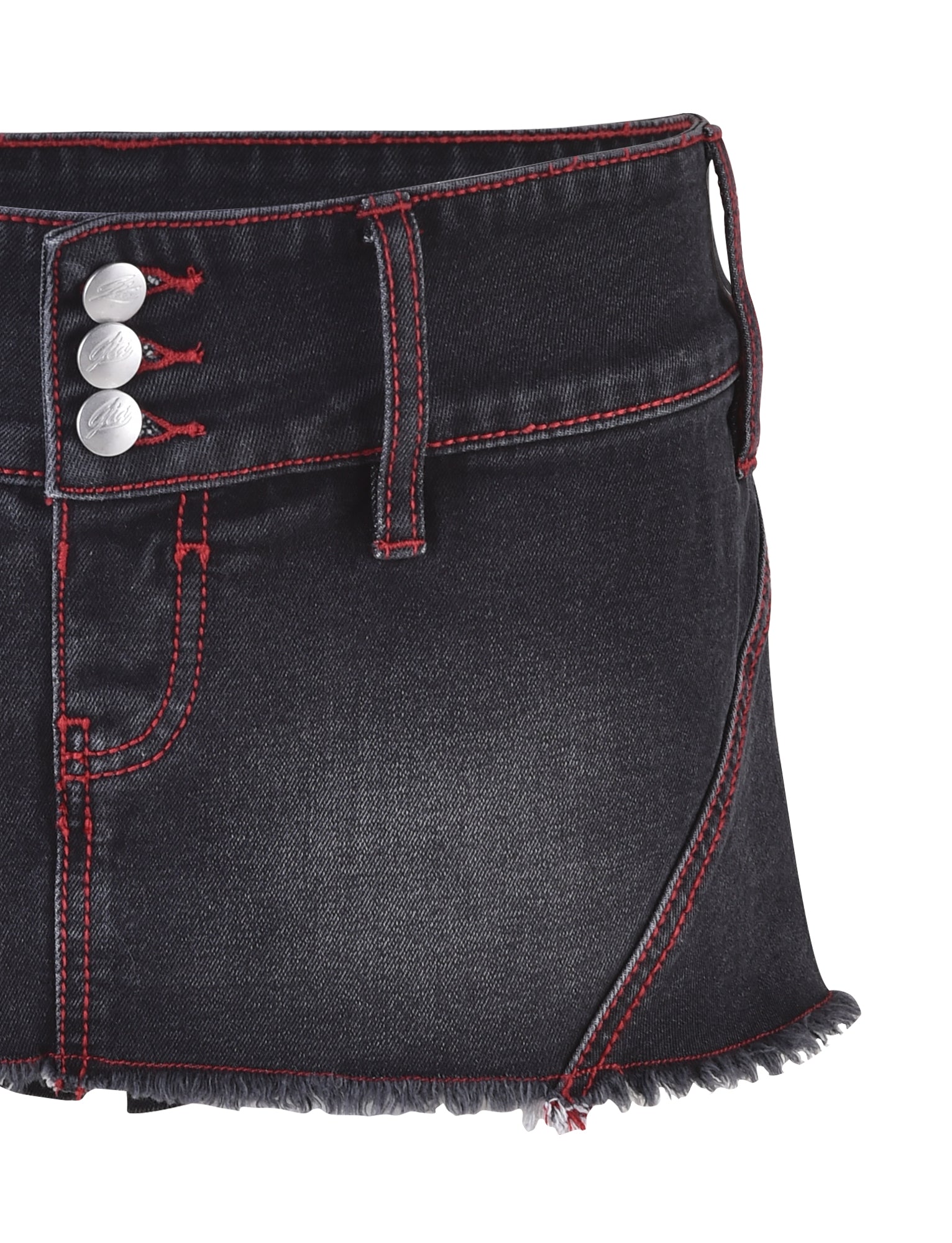 A close-up of the NYKKO SKORT by I.AM.GIA, featuring a dark denim design with red stitching and a frayed hem. The skort showcases three silver buttons on the waistband and a front pocket outlined in red.