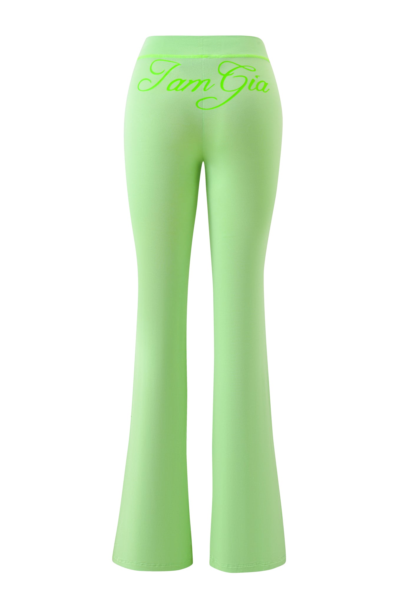 Back view of BLARE TRACKPANT - NEON GREEN by I.AM.GIA, featuring "I.AM.GIA" cursive text on the matching waistband. These bold, low-rise flared trackpants add standout style to any outfit.