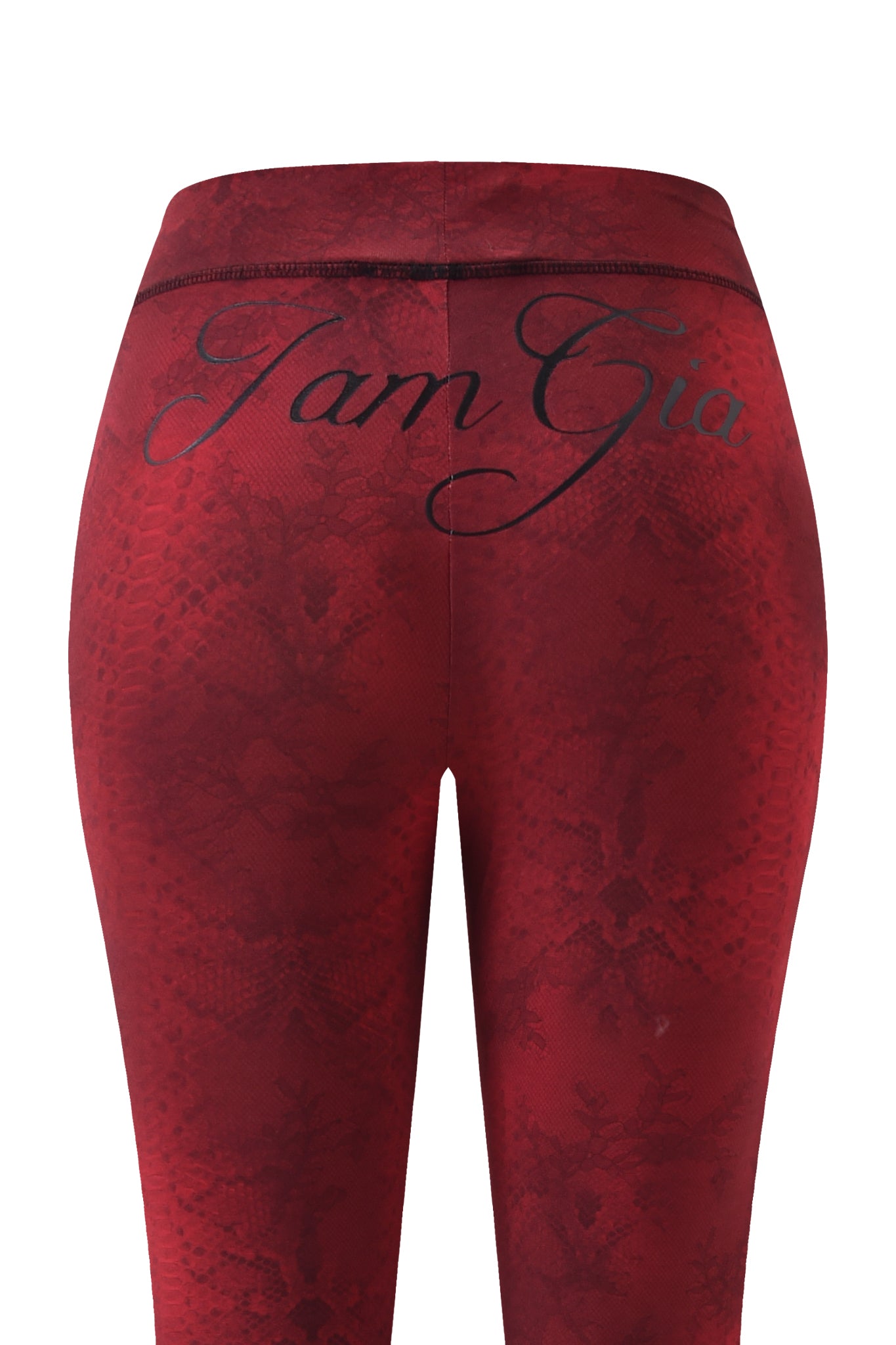 Close-up of the back of the BLARE TRACKPANT - RED SERPENTINE by I.AM.GIA, featuring a red serpentine print and "I.AM.GIA" in black script across the waistband.