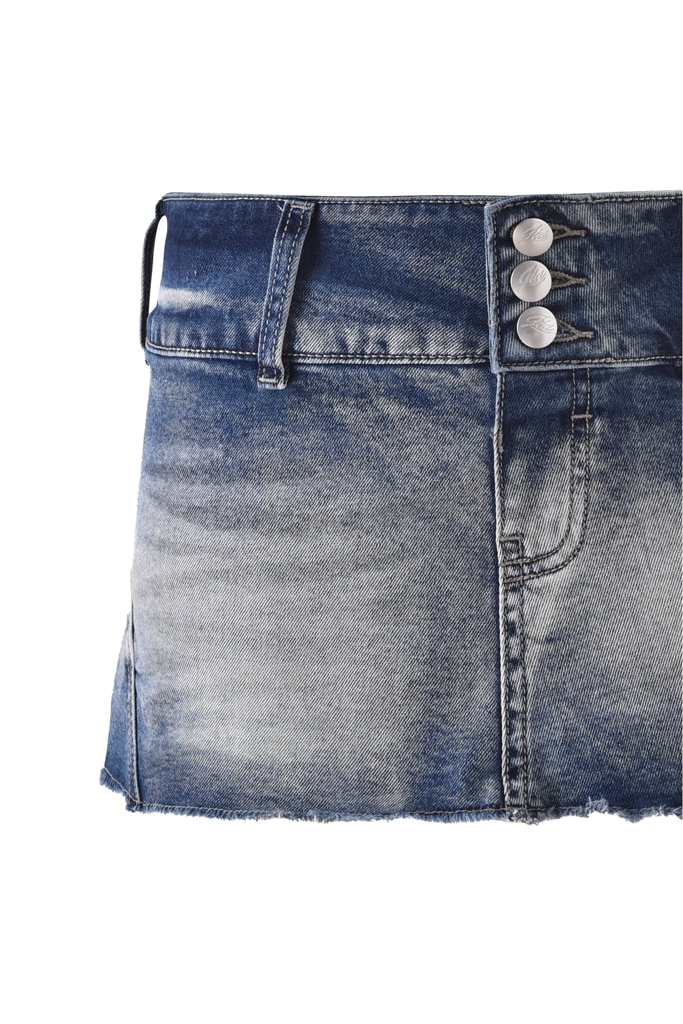 Close-up of the NYKKO SKORT - ICE BLUE by I.AM.GIA, featuring a frayed hem, three metallic front buttons, belt loops, and a faded distressed denim wash.