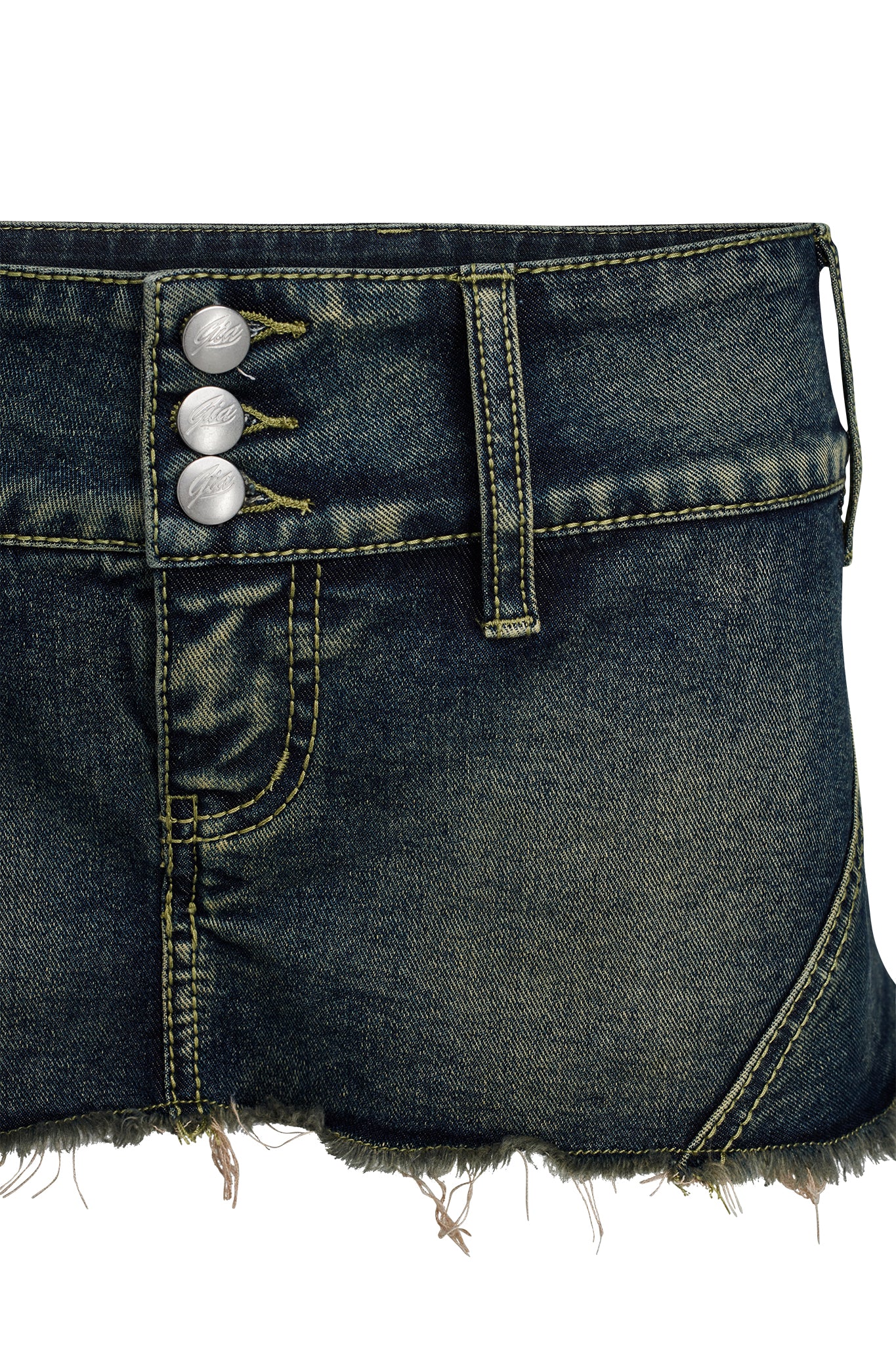 A close-up image of the dark denim NYKKO SKORT by I.AM.GIA, featuring frayed edges. The waistband showcases three silver buttons and multiple belt loops, while the fabric displays visible stitching and a worn, vintage look.