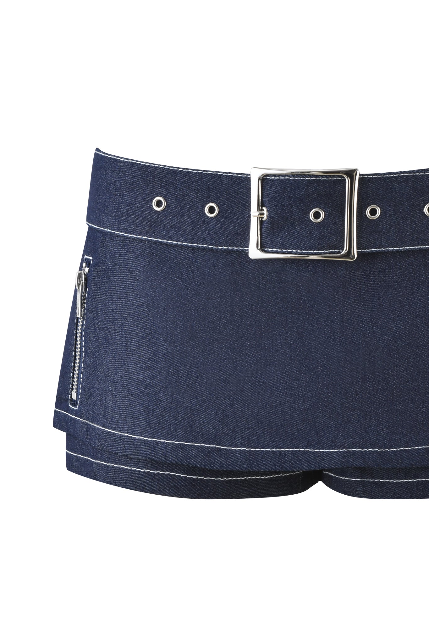 The MARRION DENIM SKORT by I.AM.GIA in dark blue denim features white stitching, a wide silver-buckled belt, and a practical side zipper pocket.