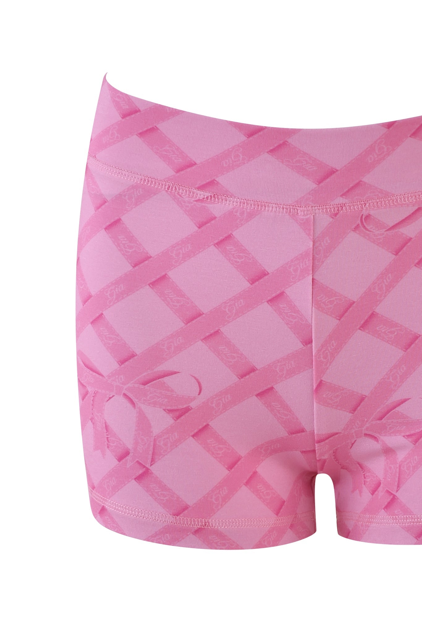 A close-up of the BLARE SHORT - PINK : WRAPPED IN GIA from I.AM.GIA highlights its pink crisscross print with subtle text accents. Made from bamboo fabric, it's smooth and stretchy, ideal for casual or athletic activities.