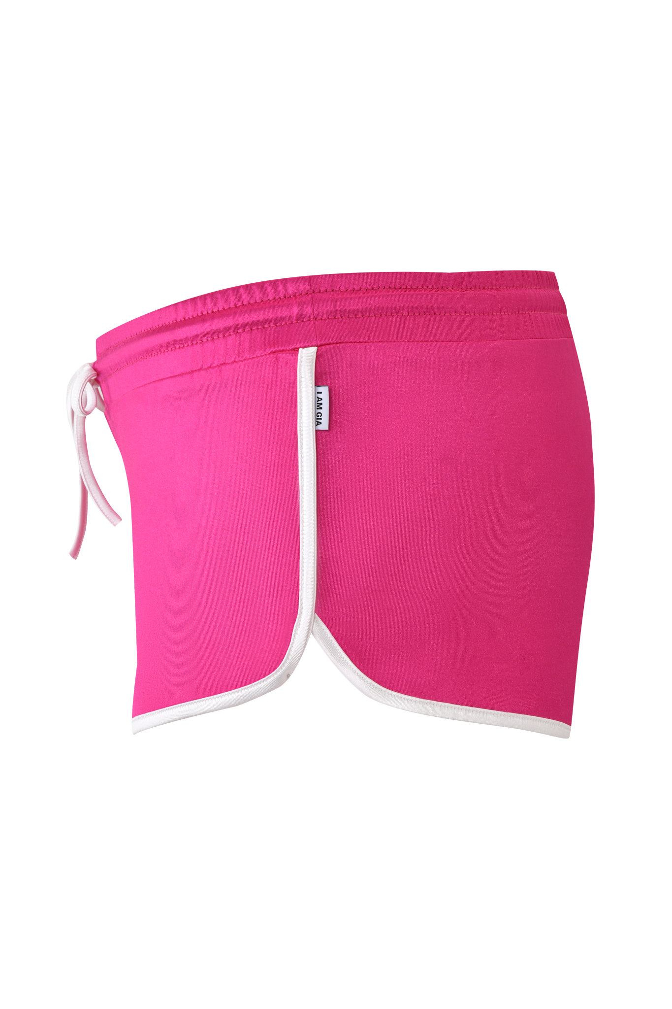 The CHERRY SHORT - DARK MAGENTA by I.AM.GIA features bright hot pink fabric with white trim, a side tag, elastic waistband with drawstring, and a sporty dolphin hem, shown from the side on a plain background.