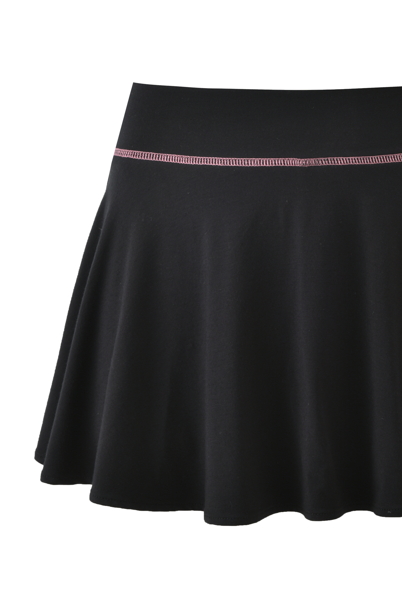 The BLARE SKORT - BLACK by I.AM.GIA features a fitted waistband, thin pink stitching near the top, and a smooth A-line silhouette in soft bamboo jersey for effortless style.