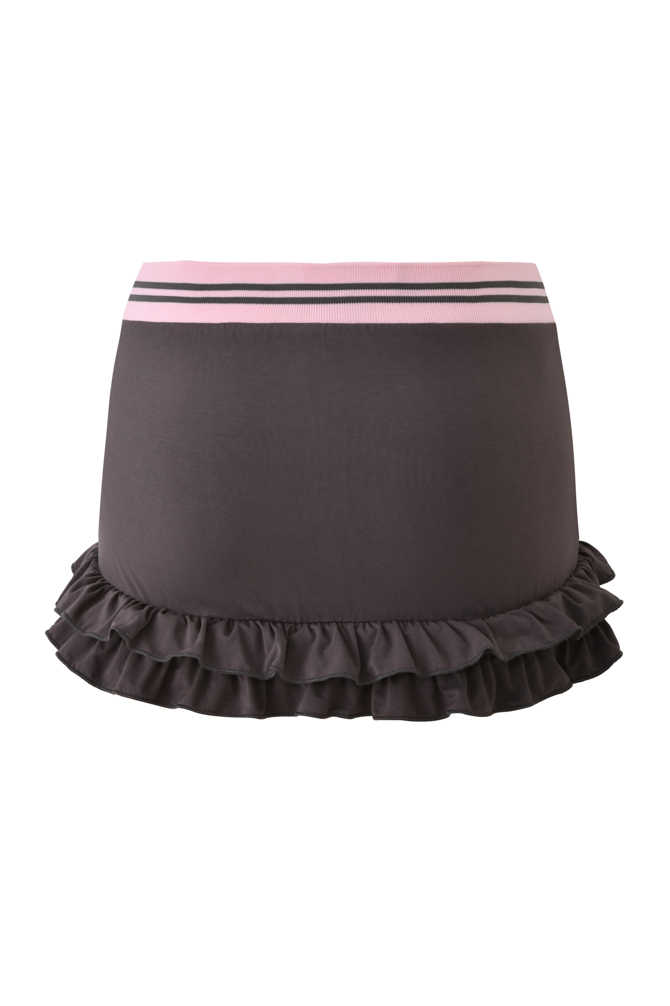 The ELLIS SKORT - GREY by I.AM.GIA is a charcoal grey bamboo jersey mini skort with a bubblegum pink and white striped waistband and layered ruffled hem, set against a light pink background with horizontal stripes.