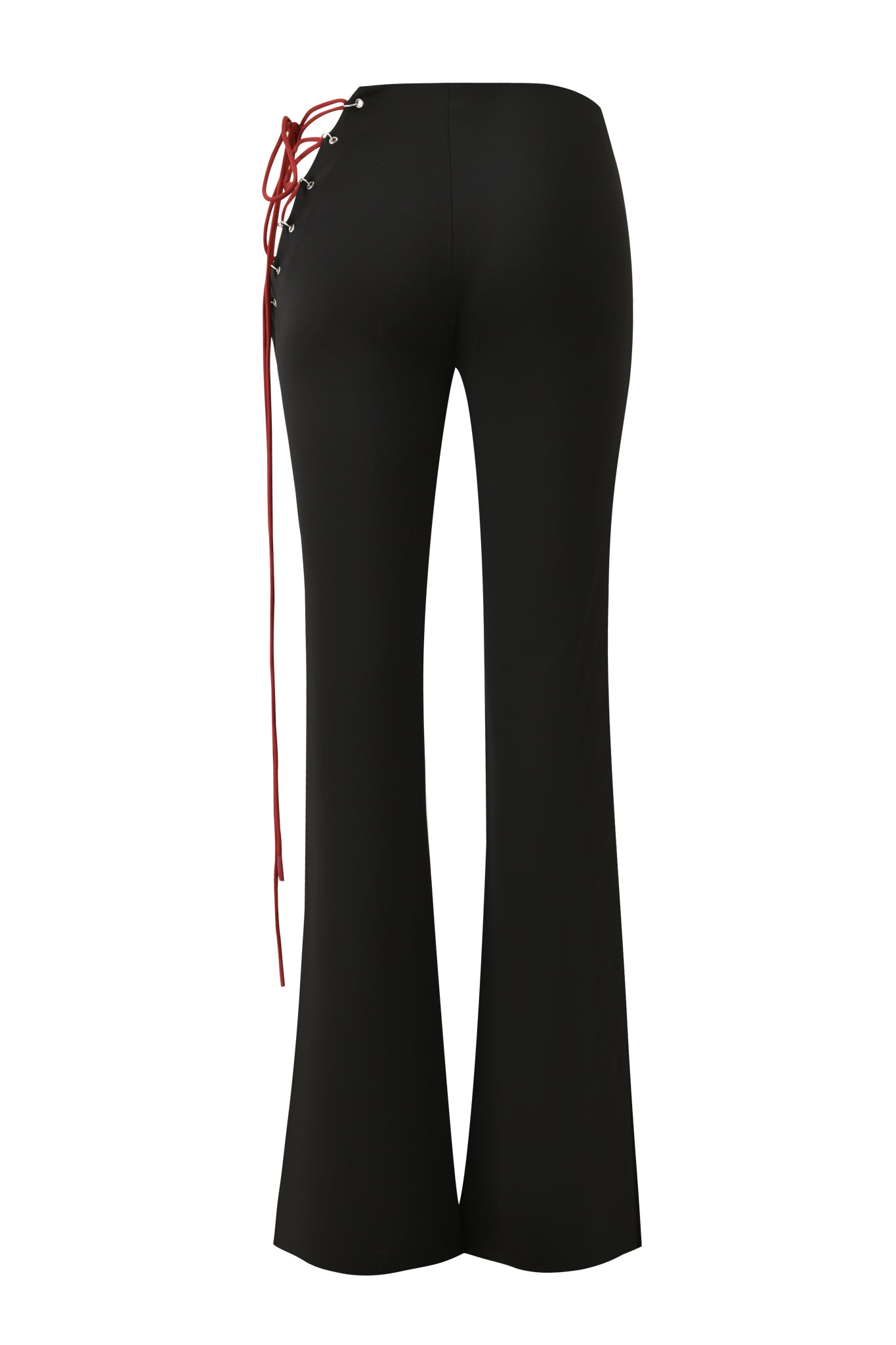 The ONYX PANT - BLACK by I.AM.GIA features a high waist, flared silhouette, and bold red lace-up detail at the cutout hip. Shown from the back on a plain white background.