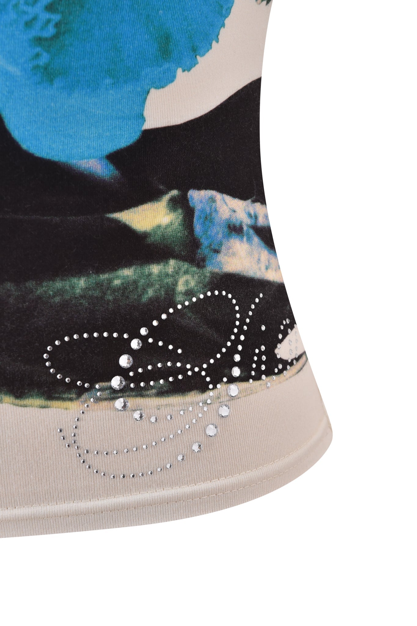 Close-up of the ADELLA TOP - BLUE by I.AM.GIA, featuring an abstract blue, green, and black print with swirling rhinestones near the hem. The off-white background accentuates its unique take on a classic cami style.