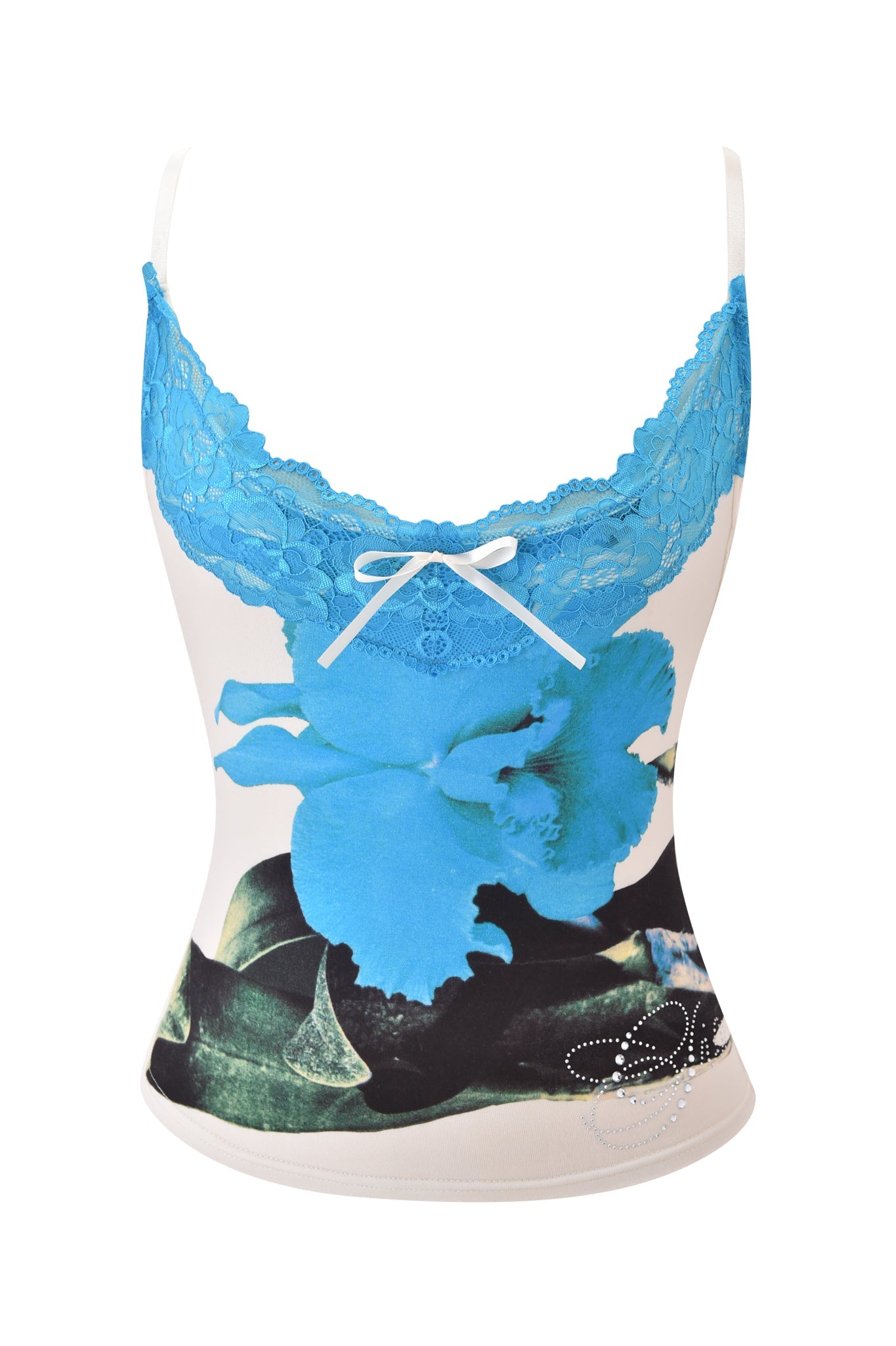 The ADELLA TOP - BLUE by I.AM.GIA is a sleeveless, fitted floral cami with blue lace trim, a white neckline bow, and a striking blue flower graphic on cream with black and green accents.
