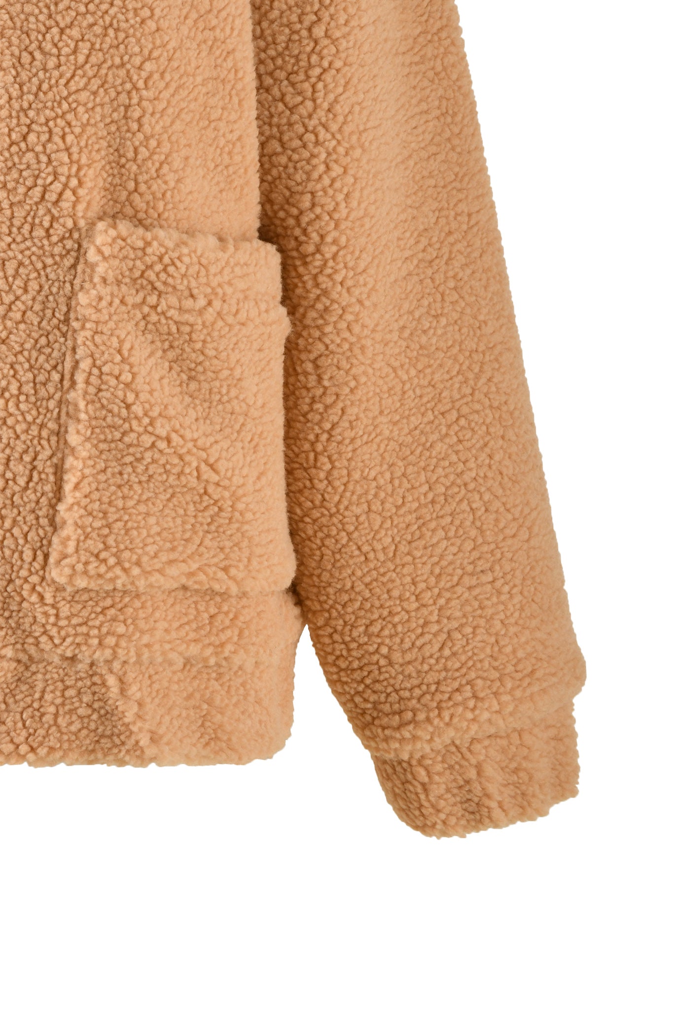 Close-up of a caramel-colored, textured fleece jacket sleeve and a portion of its front, showcasing an I.AM.GIA pocket. The material is soft with a curly, sherpa-like appearance, while the hem and cuff display a cozy, plush texture. This stylish detail comes from the PIXIE COAT by I.AM.GIA.