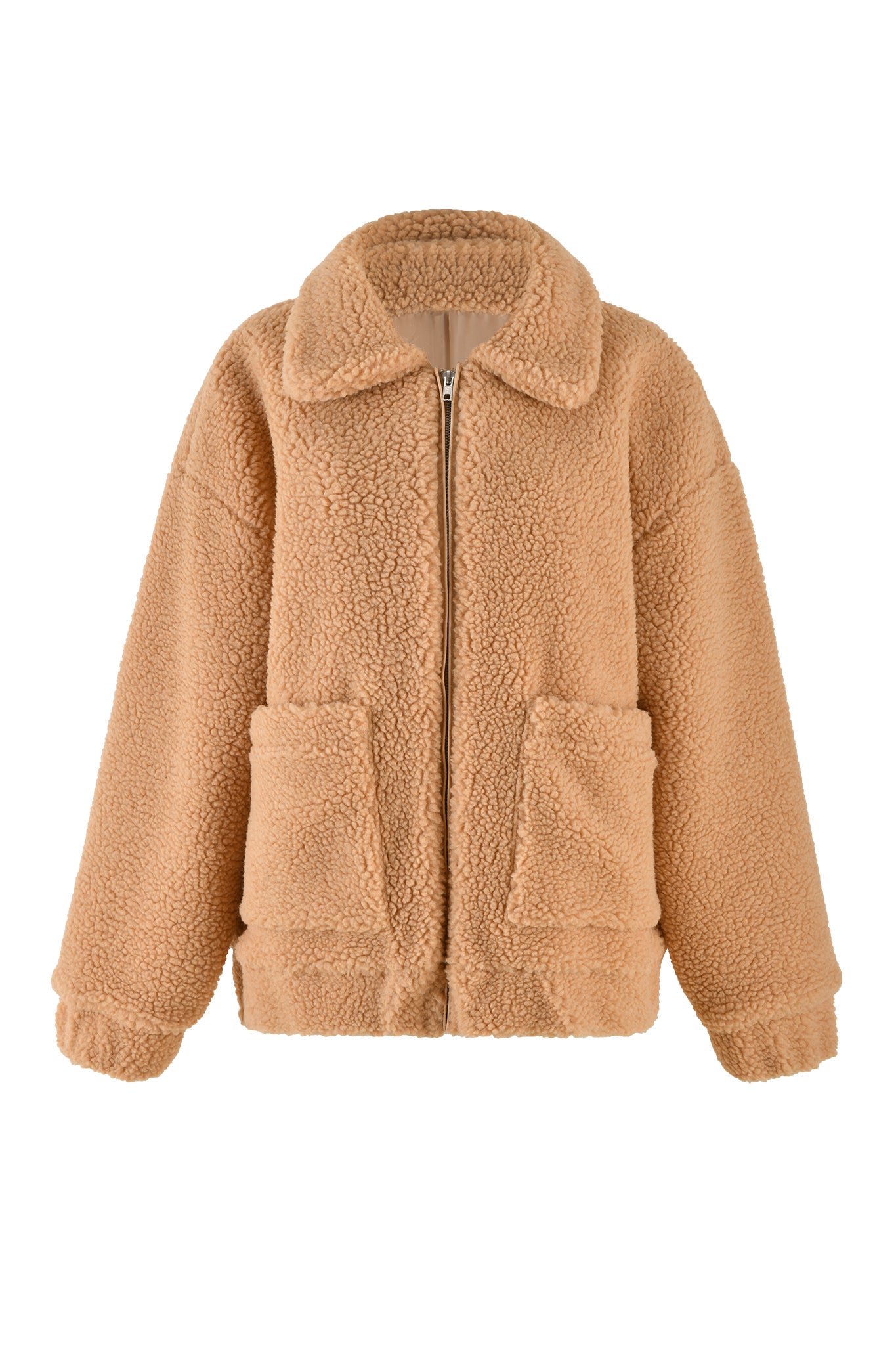 A cozy caramel sherpa jacket from I.AM.GIA with long sleeves and a front zipper closure. The PIXIE COAT features a large collar, two front pockets, and elasticized cuffs, offering both comfort and style.