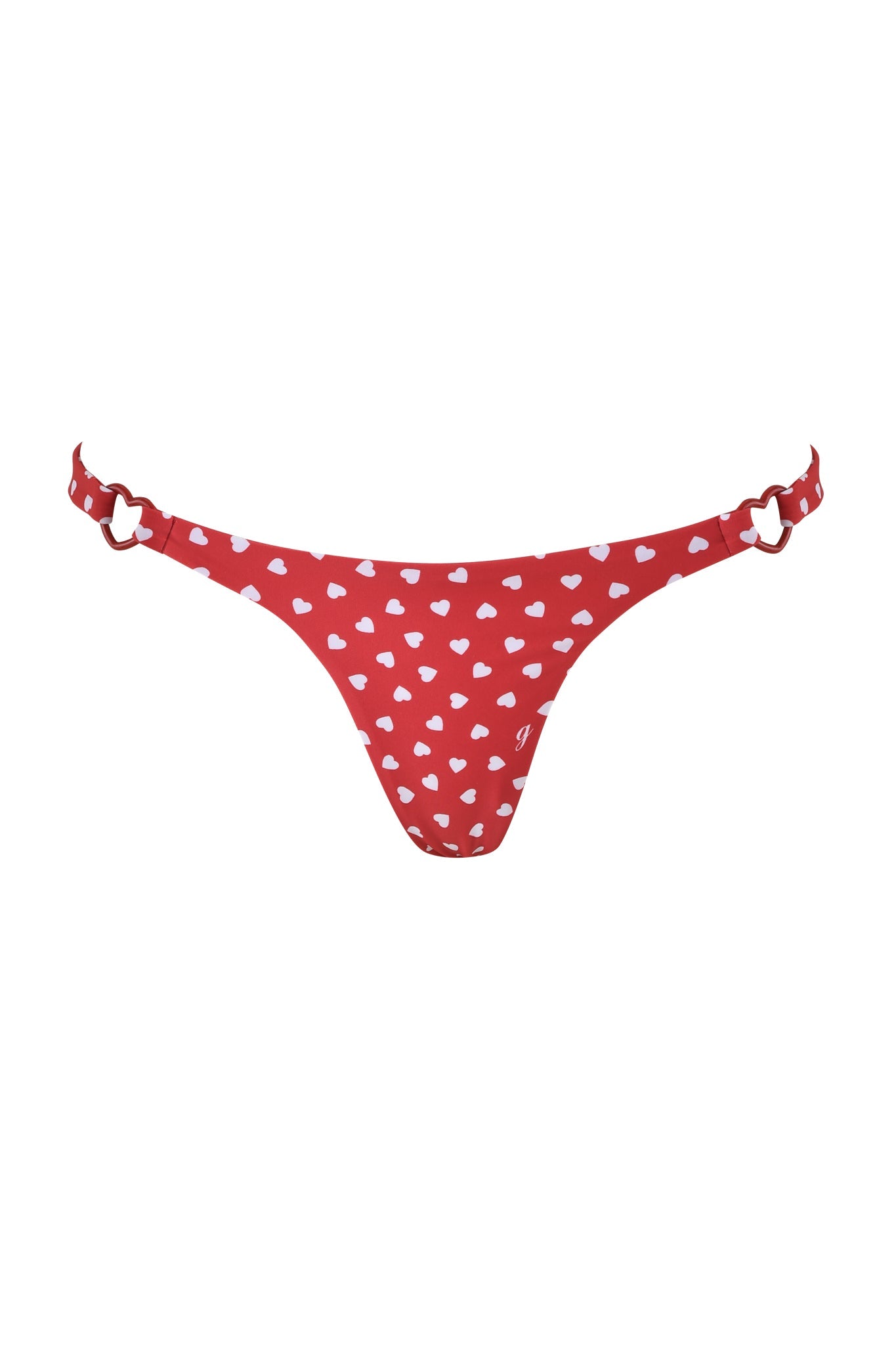 The VALENTINA BIKINI BOTTOM - RED HEARTBEAT by I.AM.GIA features a thong style with white heart prints and heart-shaped metal accents on the straps.
