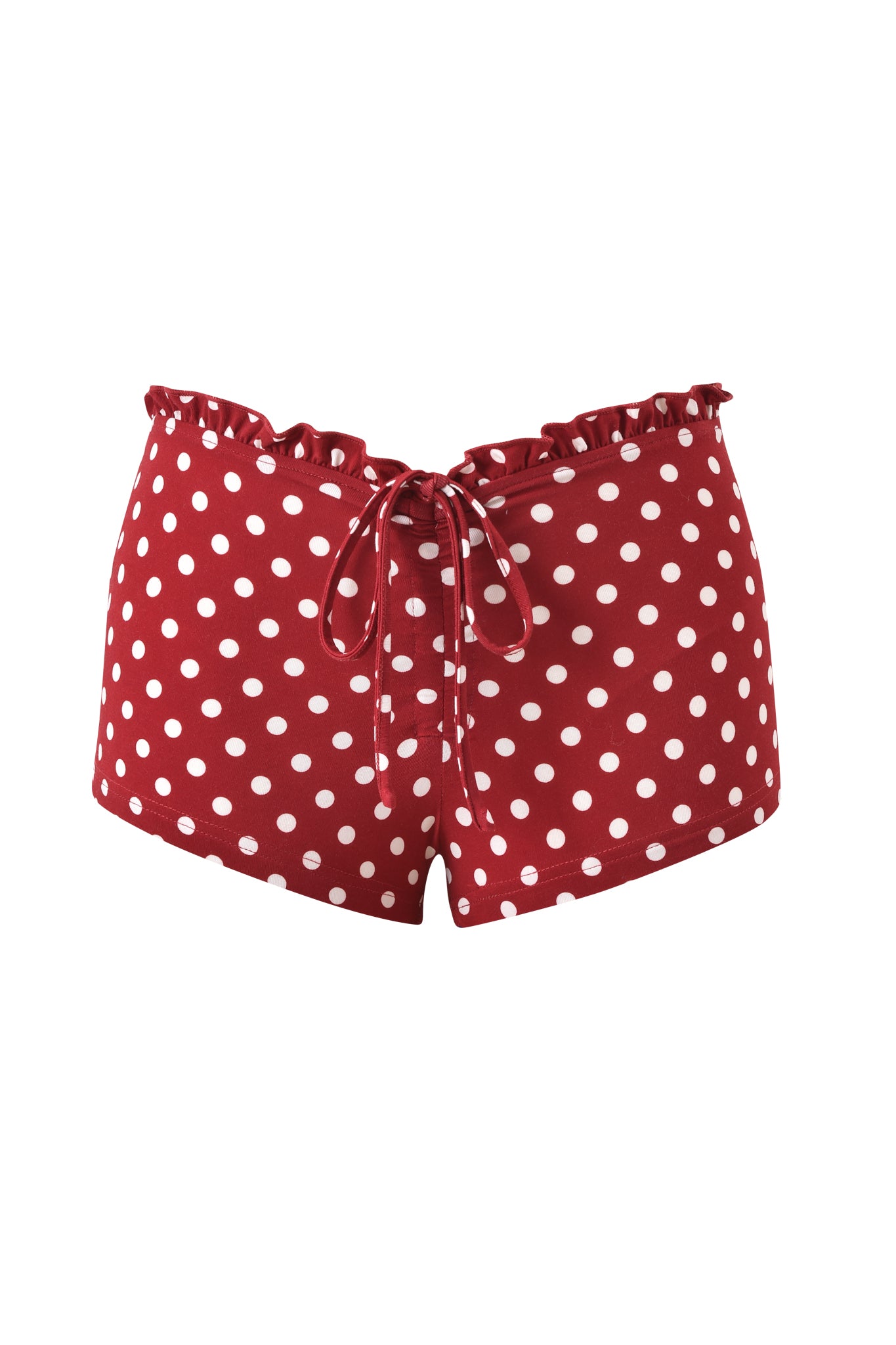 The MELANIE SHORT - RED POLKA DOT by I.AM.GIA features a ruffled waistband, front drawstring, and bodycon micro mini fit in soft bamboo jersey with red and white polka dots. Shown on a plain white background.