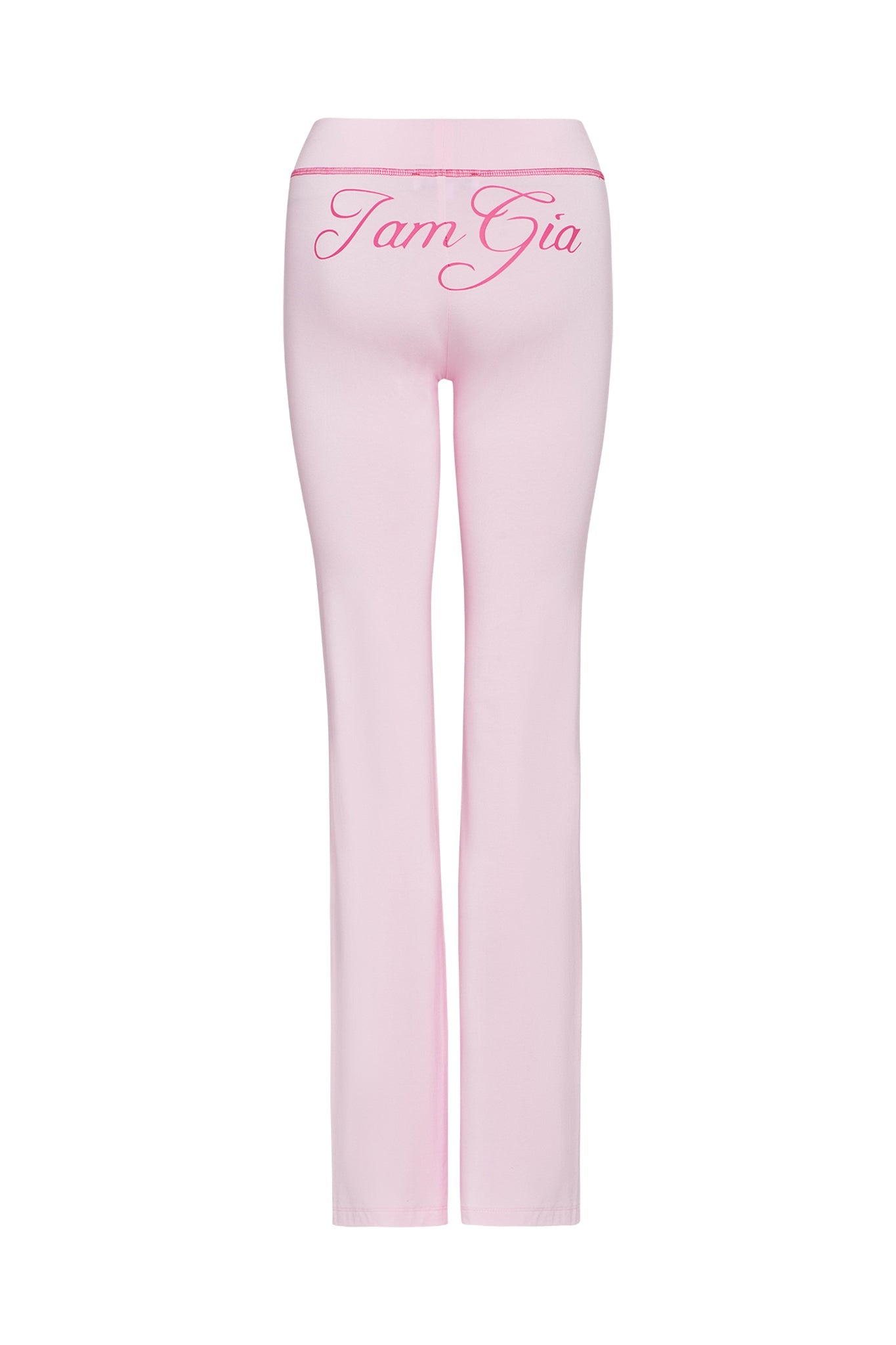 Back view of the pastel pink BLARE TRACKPANT by I.AM.GIA, showcasing the brand name in large, cursive, pink letters across the waist. The pants are displayed on a white background.